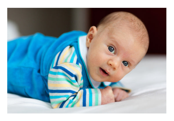 Baby Lying On A Belly  Wall Art